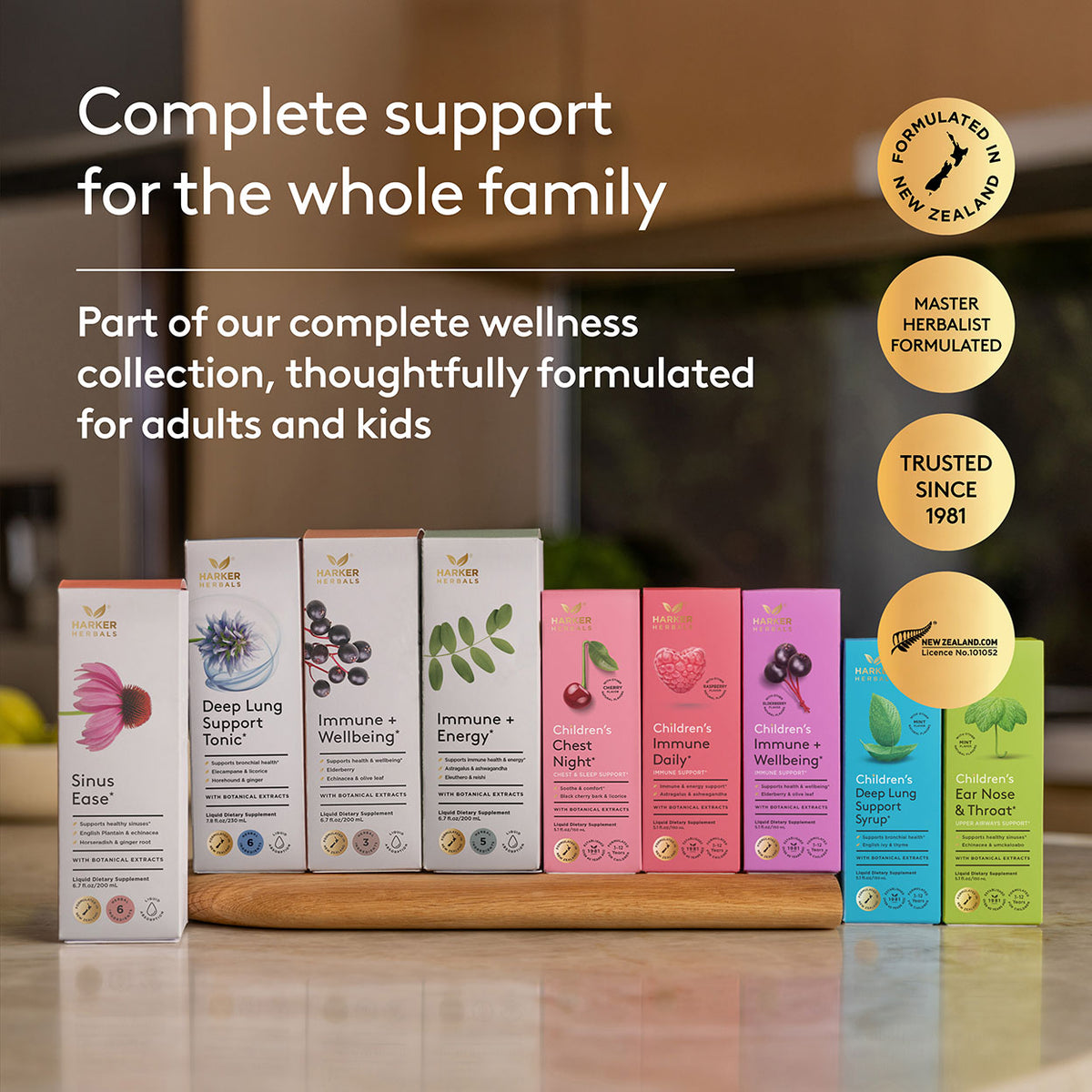 Collection of Harker Herbal Herbal formula support health product boxes on a wooden surface with promotional text about family support and wellness.